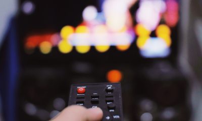 Anonymous person with TV remote