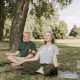 An Elderly Couple Meditating in the Park