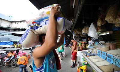 man carrying sack of rice