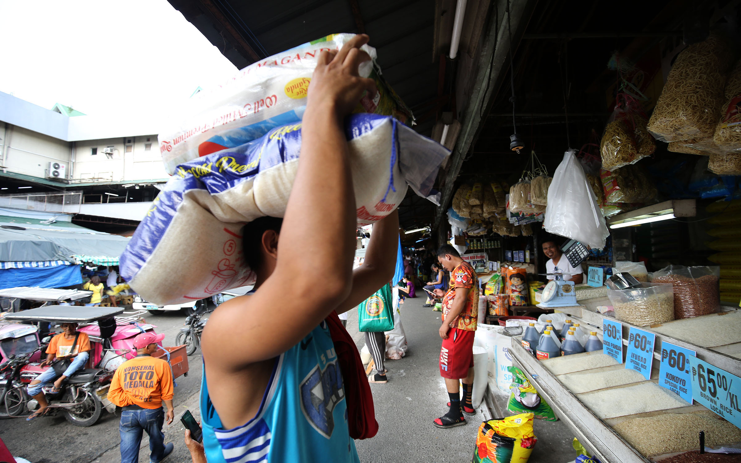 man carrying sack of rice