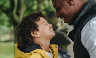 father and son laughing