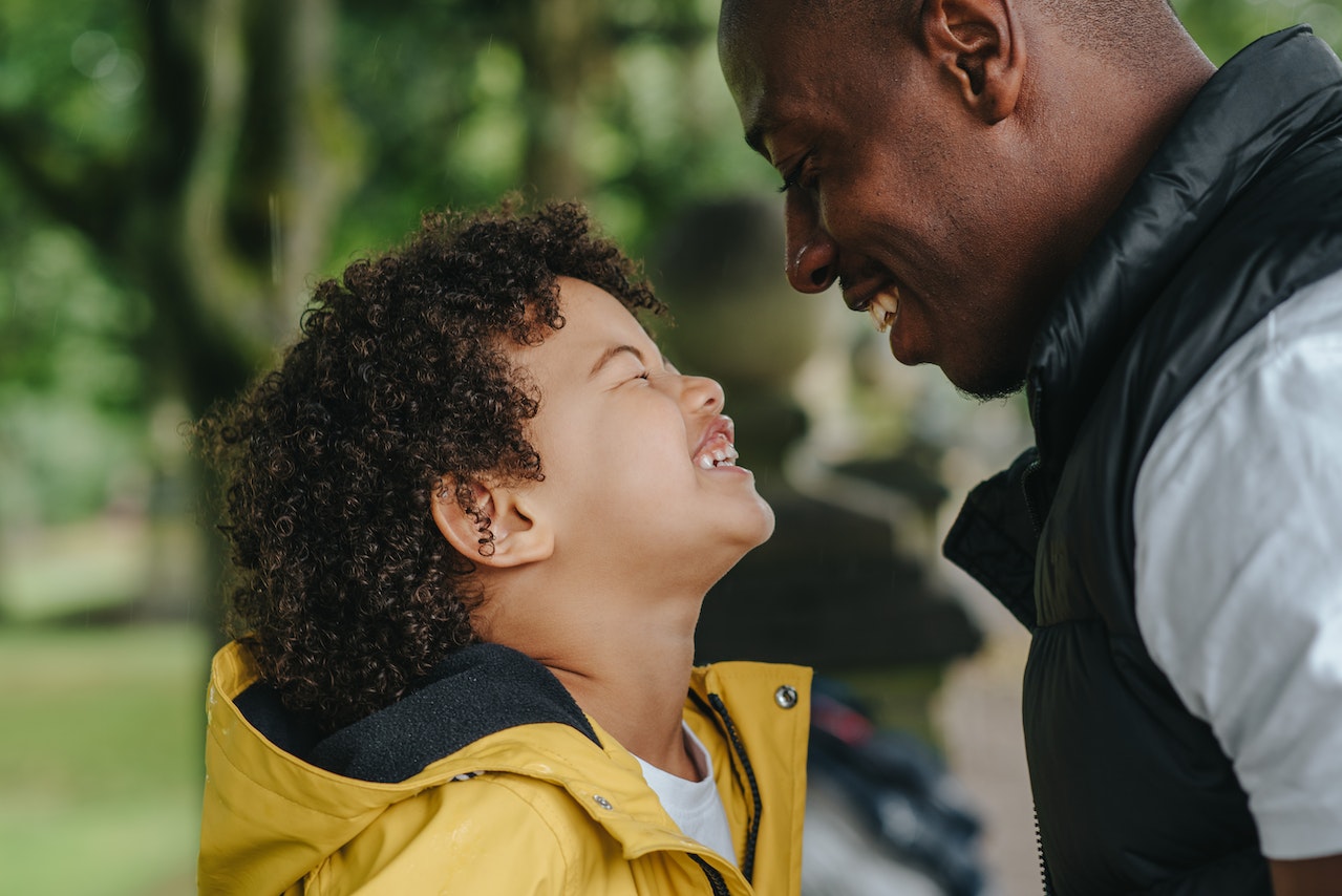 father and son laughing