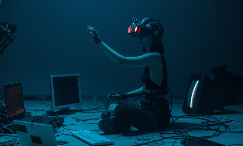 A Woman in a Tank Top Using a VR Headset