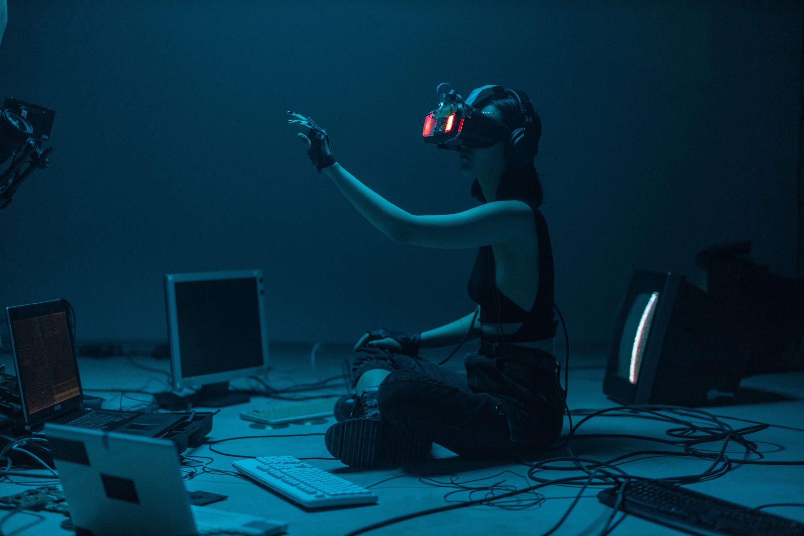 A Woman in a Tank Top Using a VR Headset