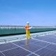 man standing on solar panels