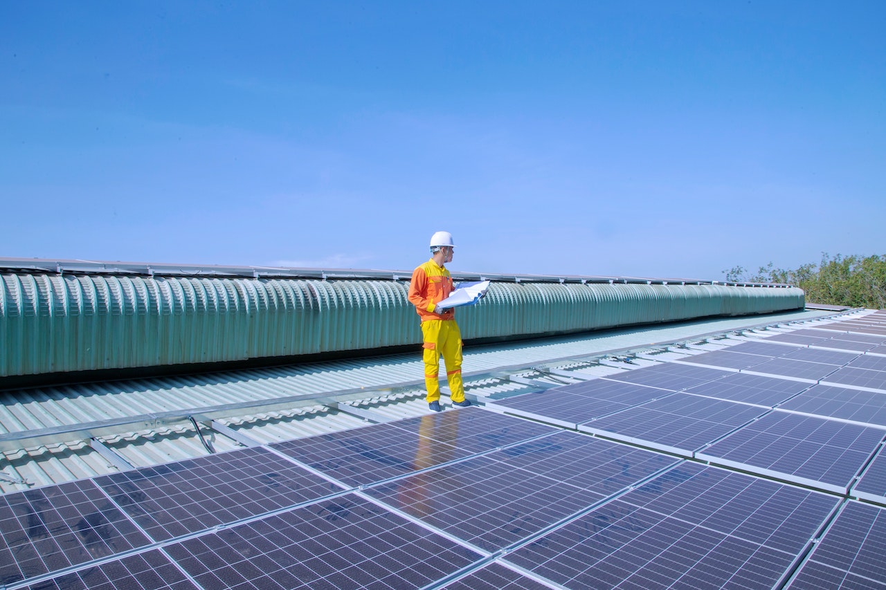 man standing on solar panels