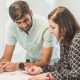 couple signing documents