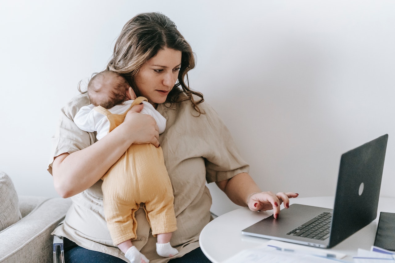 mother and child in front of laptop
