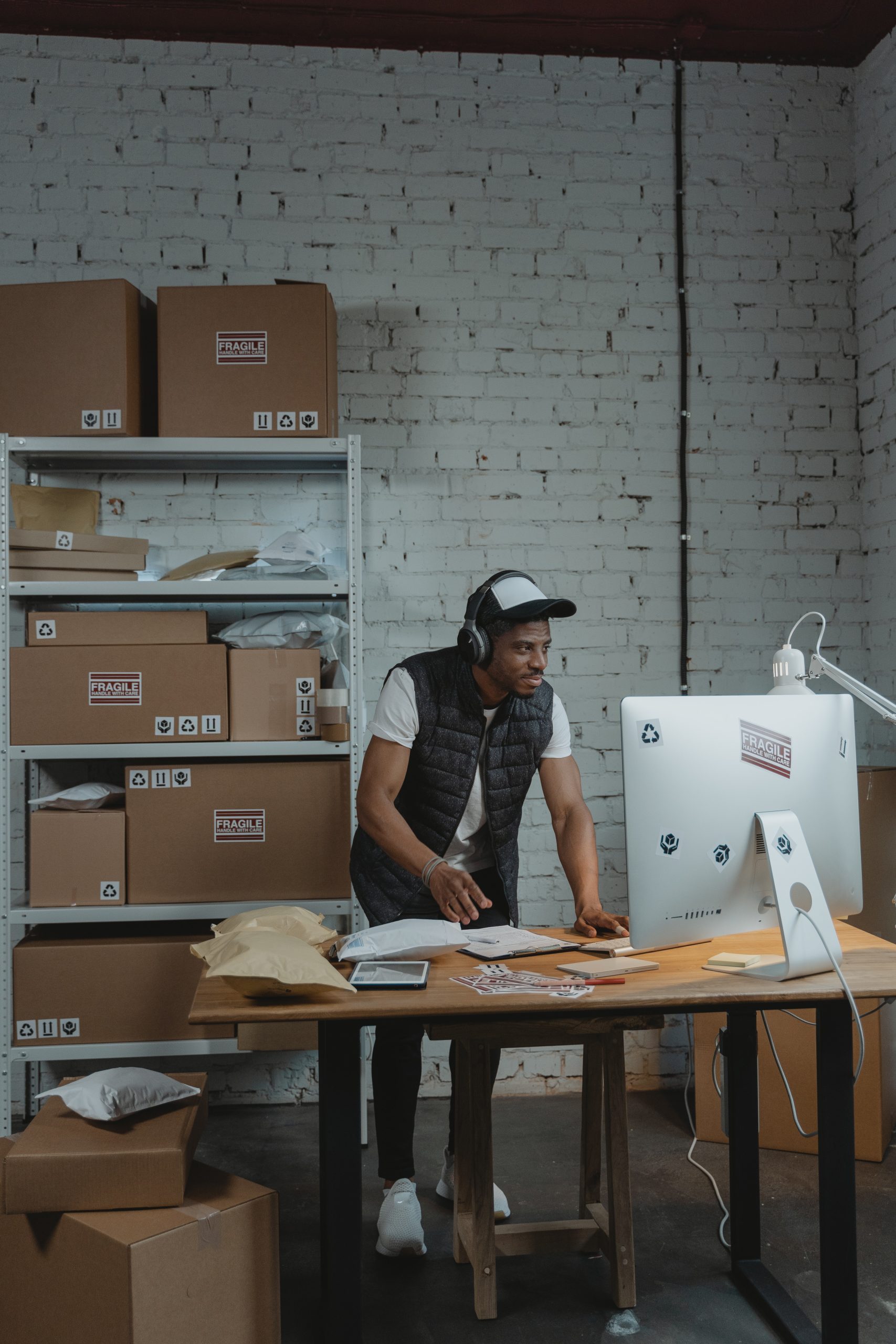 Man in Black Vest and Wearing a Headphones