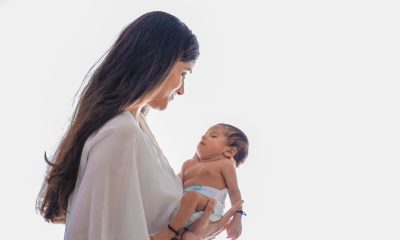 mommy carrying newborn baby