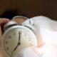 Photo of Person Holding Alarm Clock