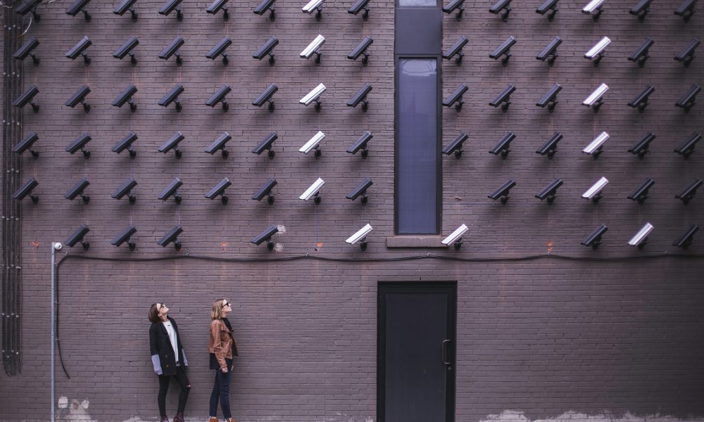 Two Person Standing Under Lot of Bullet Cctv Camera