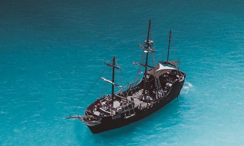 A Pirate Ship Sailing on Blue Sea
