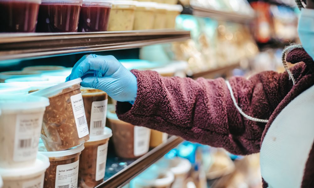Woman choosing frozen product in supermarket