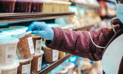 Woman choosing frozen product in supermarket