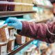 Woman choosing frozen product in supermarket