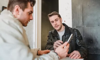 men looking at phone