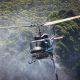 Helicopter Flying above Forest