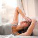 Woman in Gray Tank Top Lying on Bed