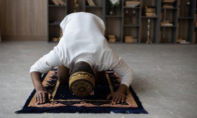 Muslim black man praying at home