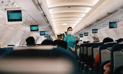 A Flight Attendant Standing in the Cabin