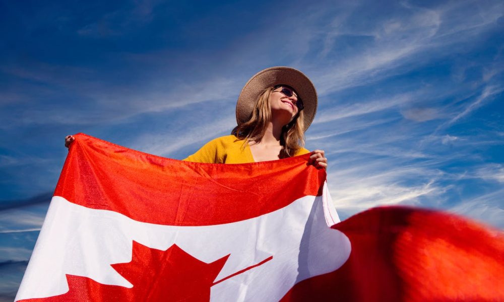 A Photograph of a Woman Holding a Canadian Flag