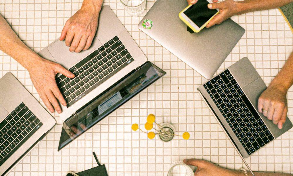 laptops phones on table