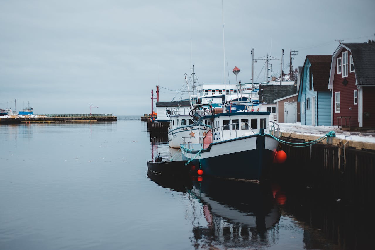 Moored boats in calm snowy port