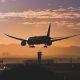 silhouette of landing airplane
