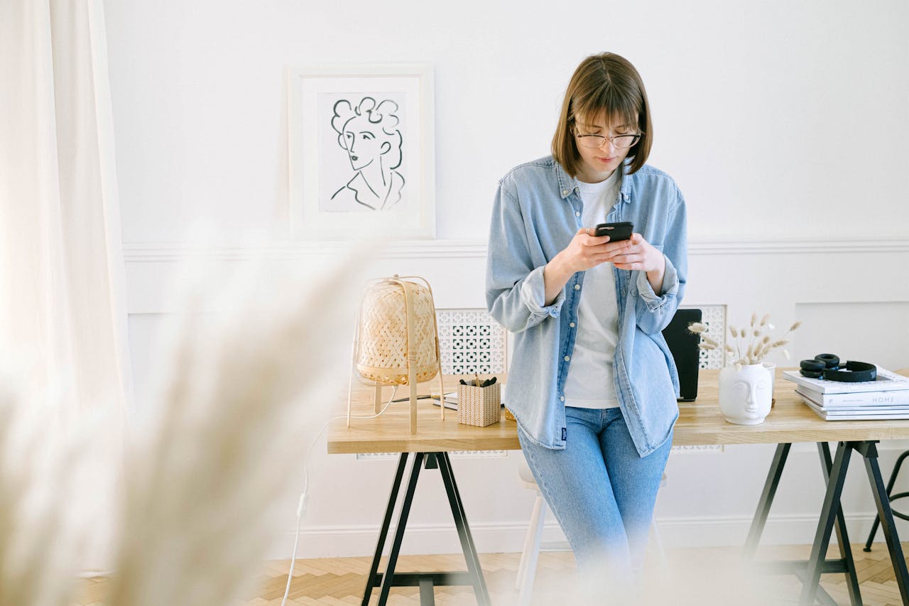 woman slouching looking at phone