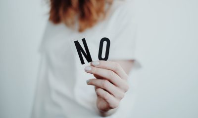 Person Holding Letters 'NO'
