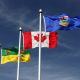 From left to right, the flags of Saskatchewan, Canada, and Alberta flying together in Lloydminster, Saskatchewan/Alberta