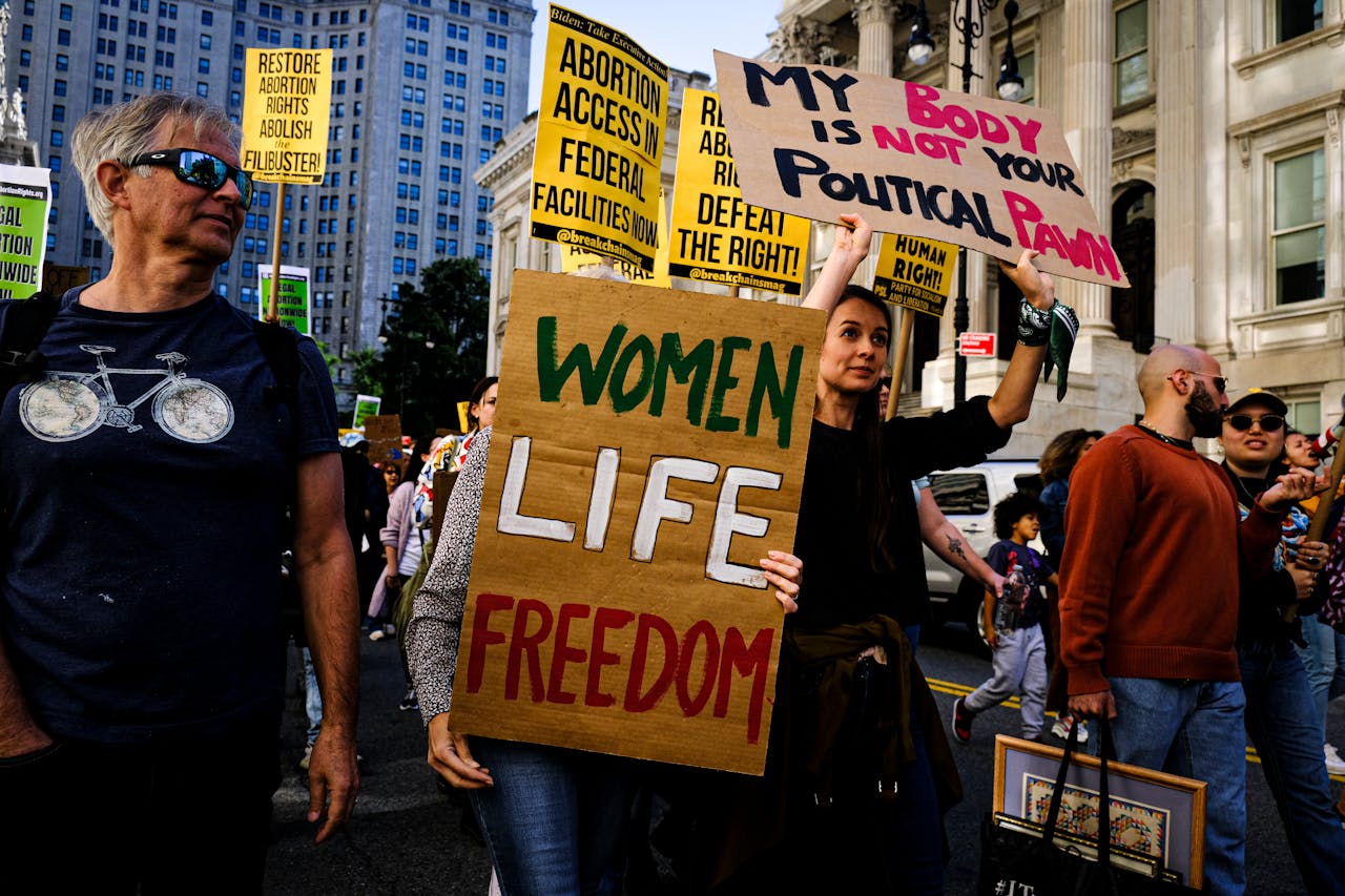 People with Protest Signs Demonstrating in the City Street