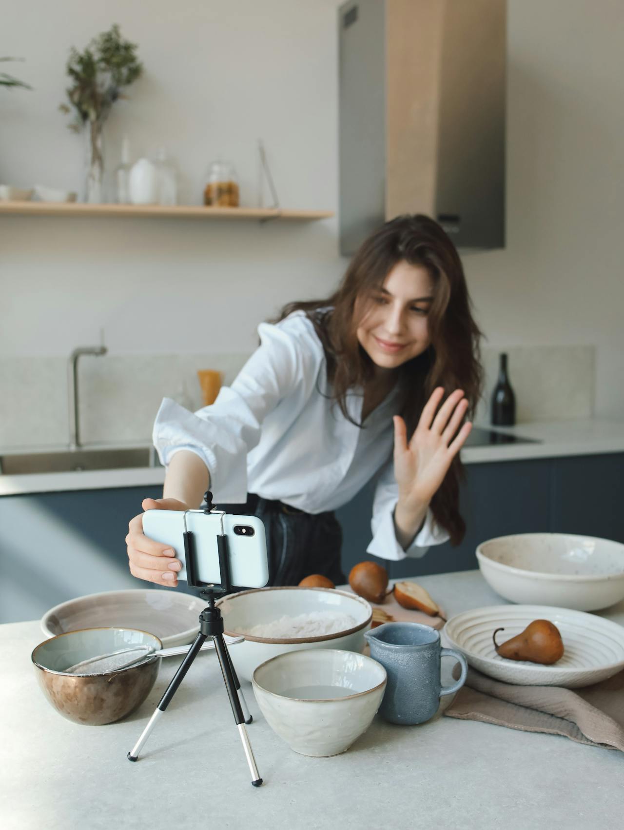 A Woman in White Long Sleeves Posing at the Camera