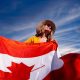 A Photograph of a Woman Holding a Canadian Flag