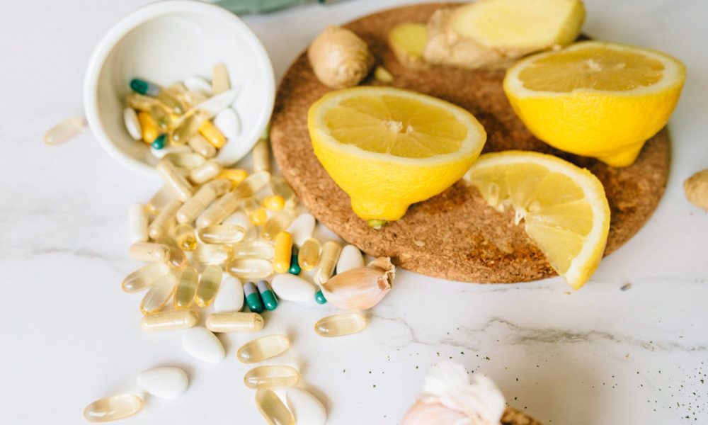 supplement tablets and sliced lemons