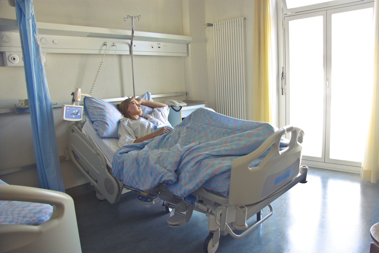 woman lying on hospital bed