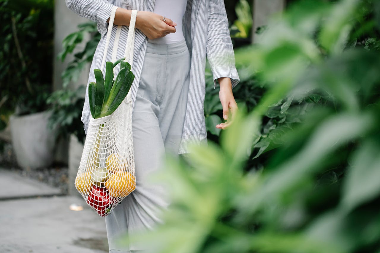 woman carrying grocery bag