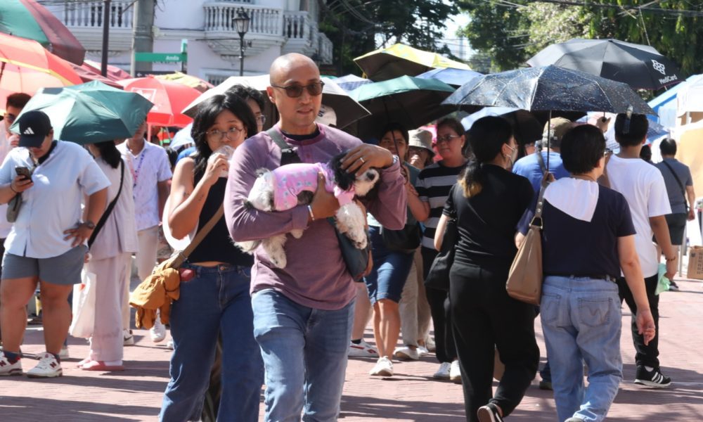people walking under the heat of the sun