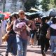 people walking under the heat of the sun