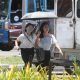 women walking under the heat