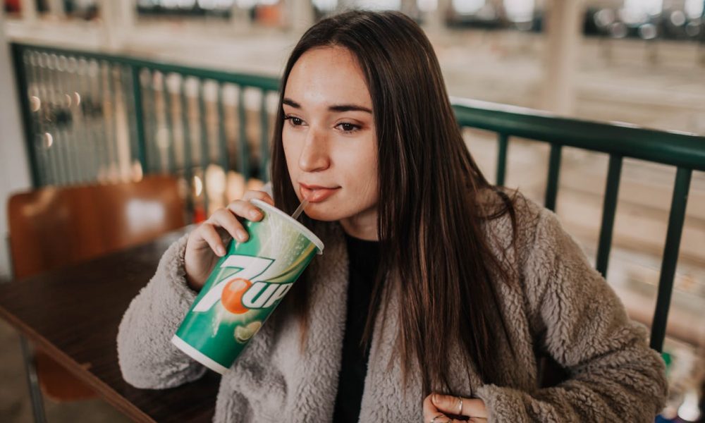 woman drinking softdrink