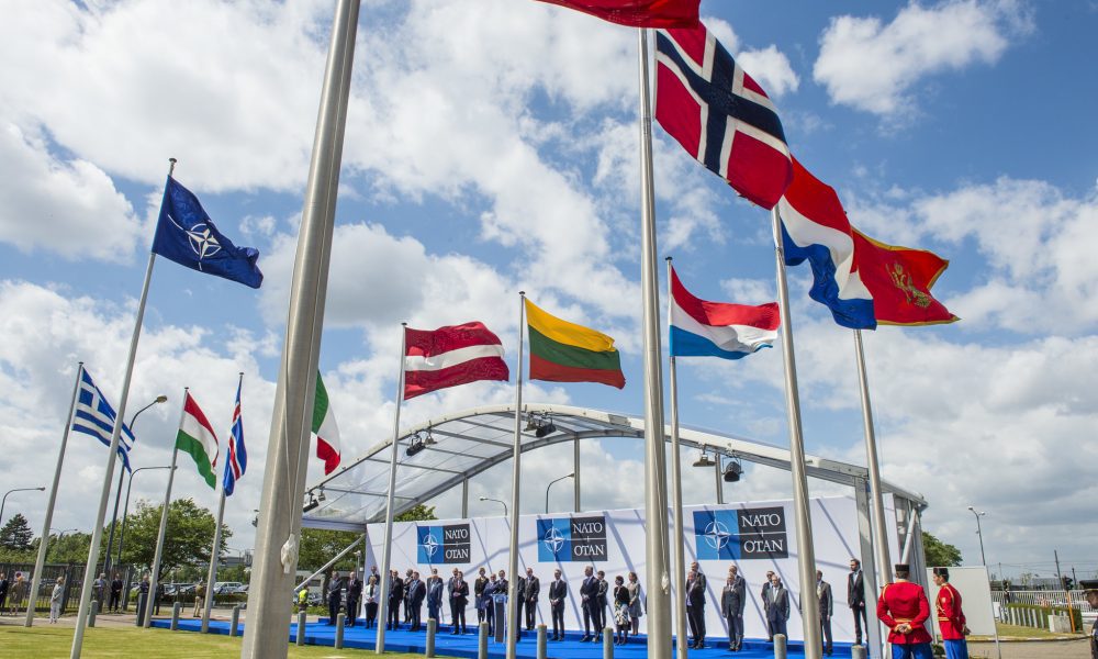 NATO flags and leaders