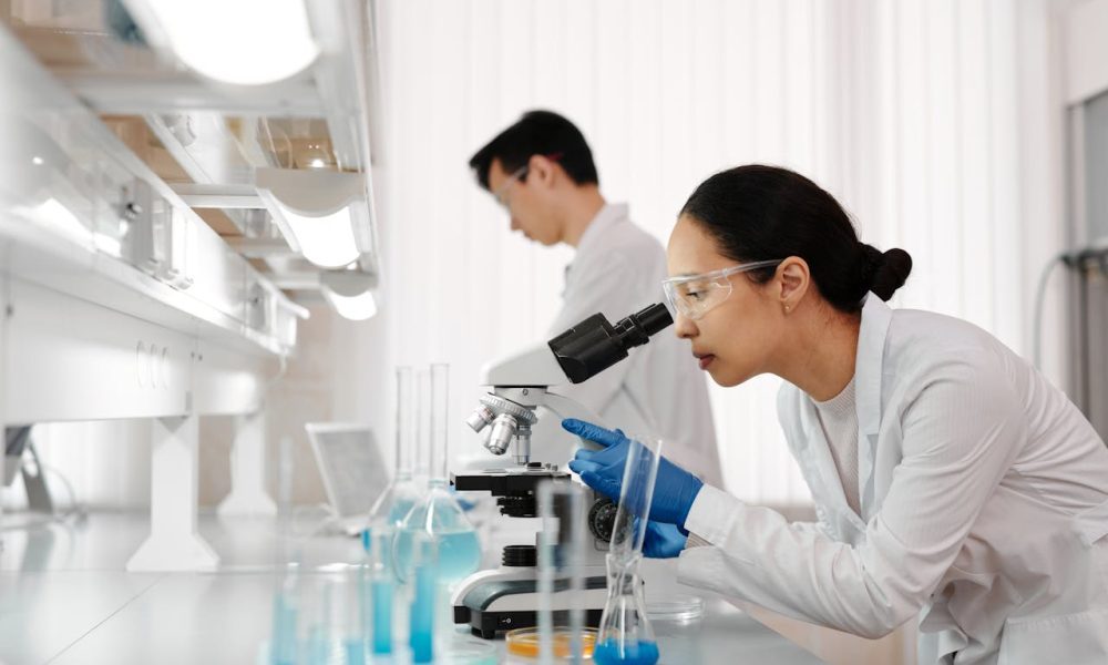 woman using microscope