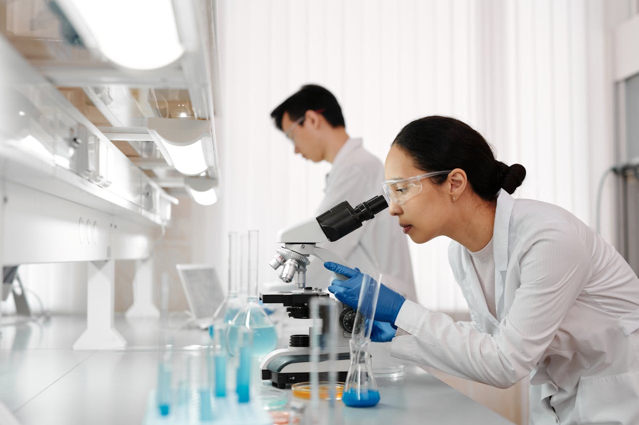 woman using microscope