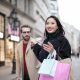 Woman in Black Coat Holding a Shopping Bags