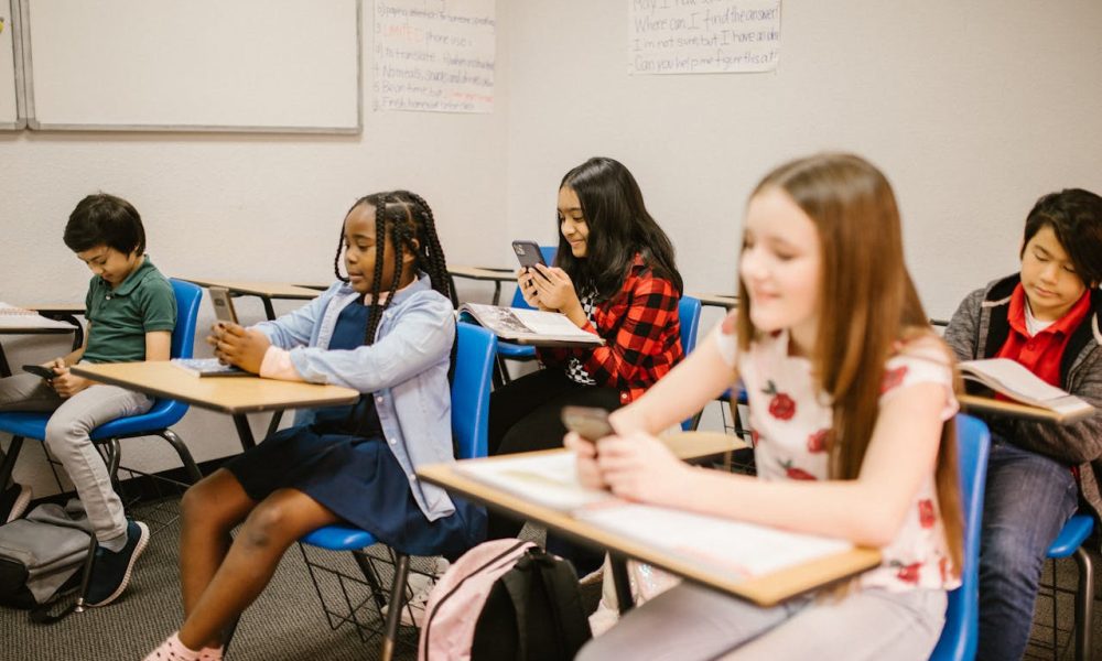 students kids using mobile phone