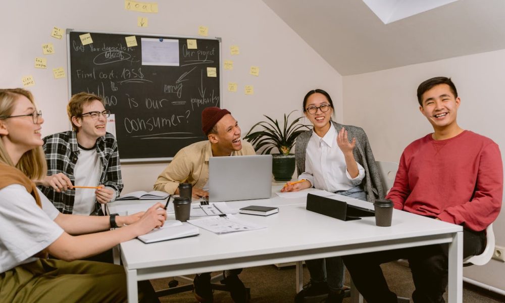 People Laughing While in a Meeting