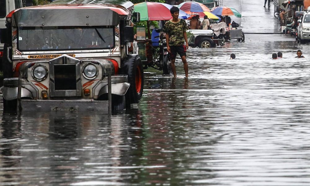 jeepney in the middle of the flood