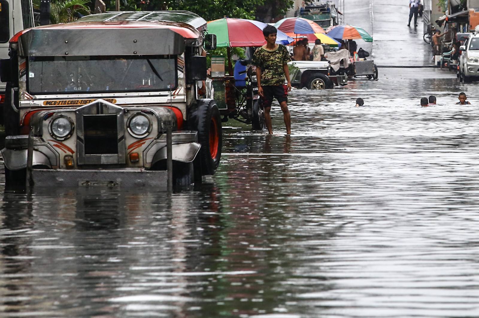jeepney in the middle of the flood